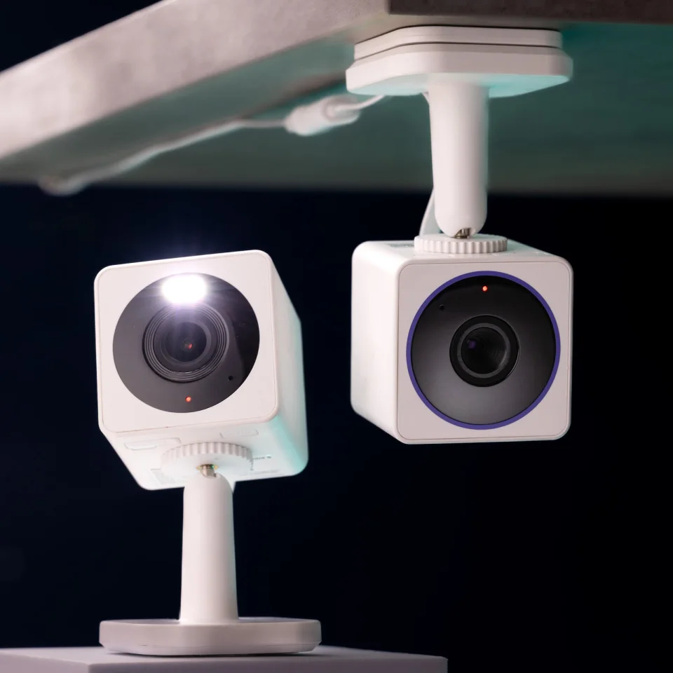Two Wyze Cam OG cameras demonstrating the built-in spotlight at night