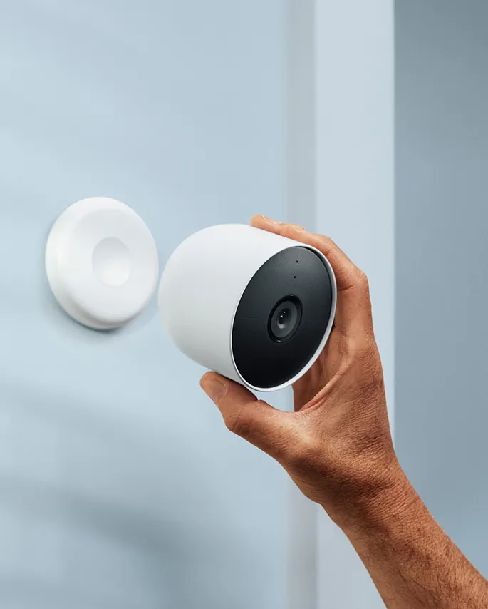 Google Nest Cam (battery) held near its magnetic wall mount