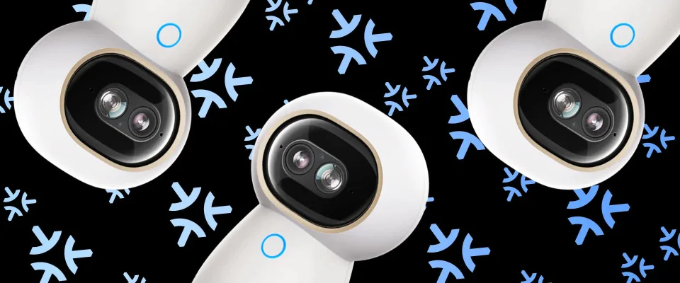 Close-up of three Aqara Camera Hub G350 dual-lens camera heads on a black patterned background