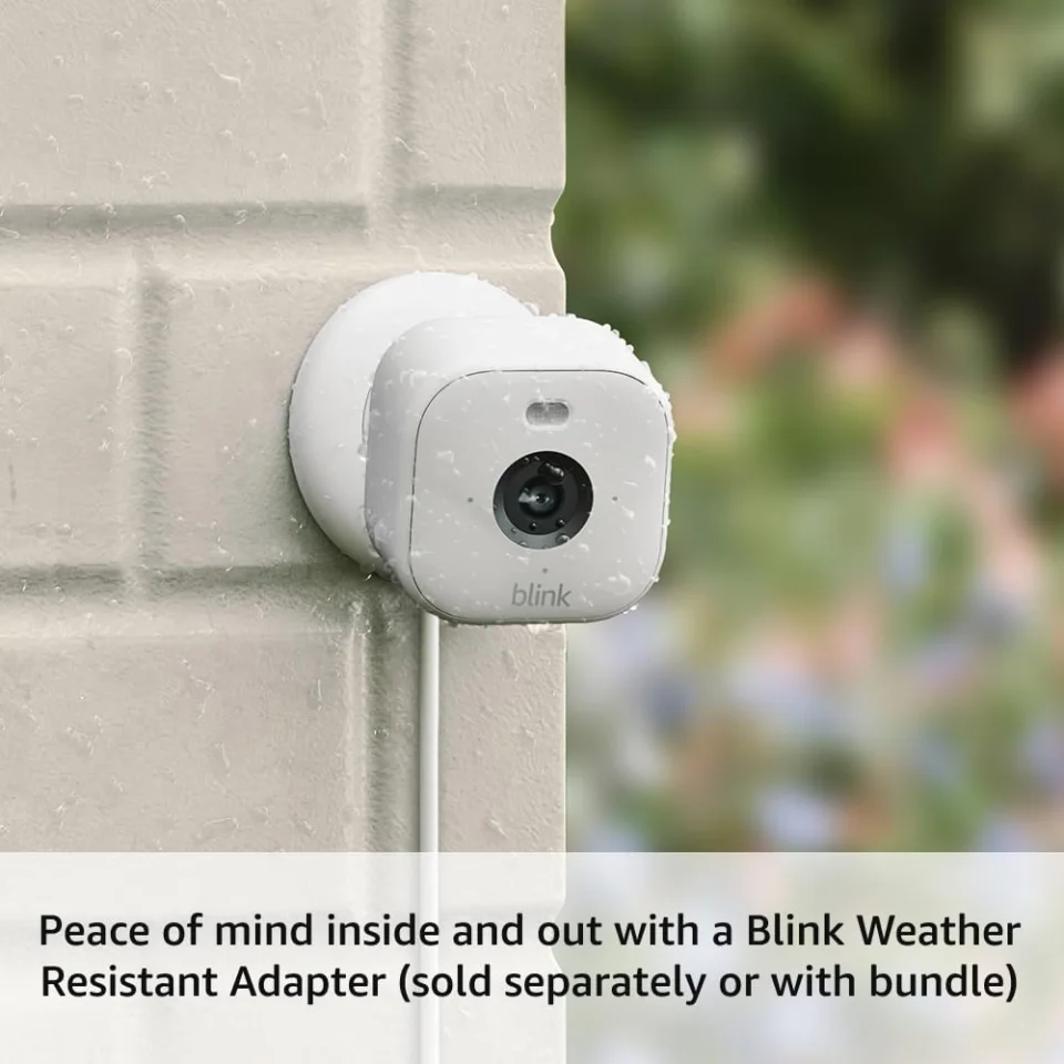 Blink Mini 2 mounted on an exterior wall for outdoor use with the weather resistant adapter
