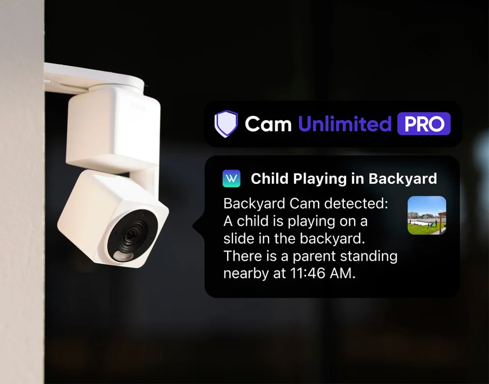 Wyze Cam Pan v4 wall-mounted at night beside a Cam Unlimited Pro descriptive alert about a child playing in a backyard