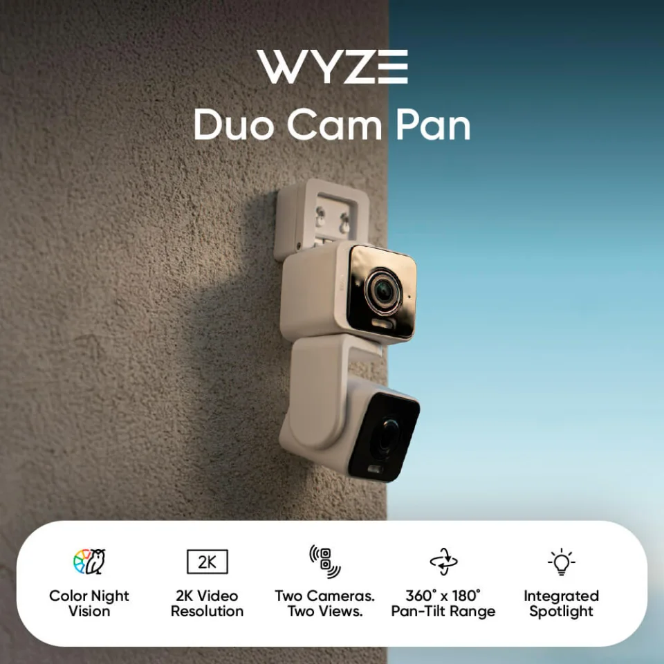 Wyze Duo Cam Pan wall-mounted outdoors, showing both lenses and its integrated spotlight