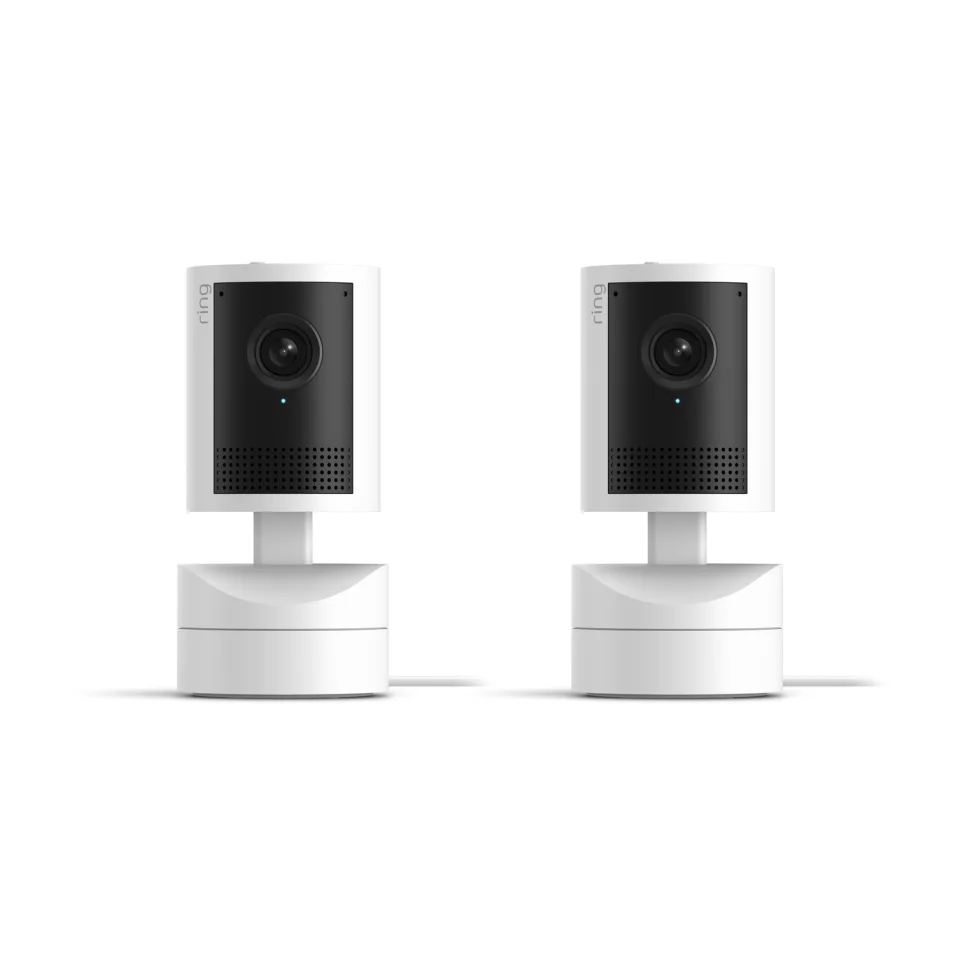Two white Ring Pan-Tilt Indoor Cam 2K cameras side by side, showing the lens, speaker grille and pan-tilt base