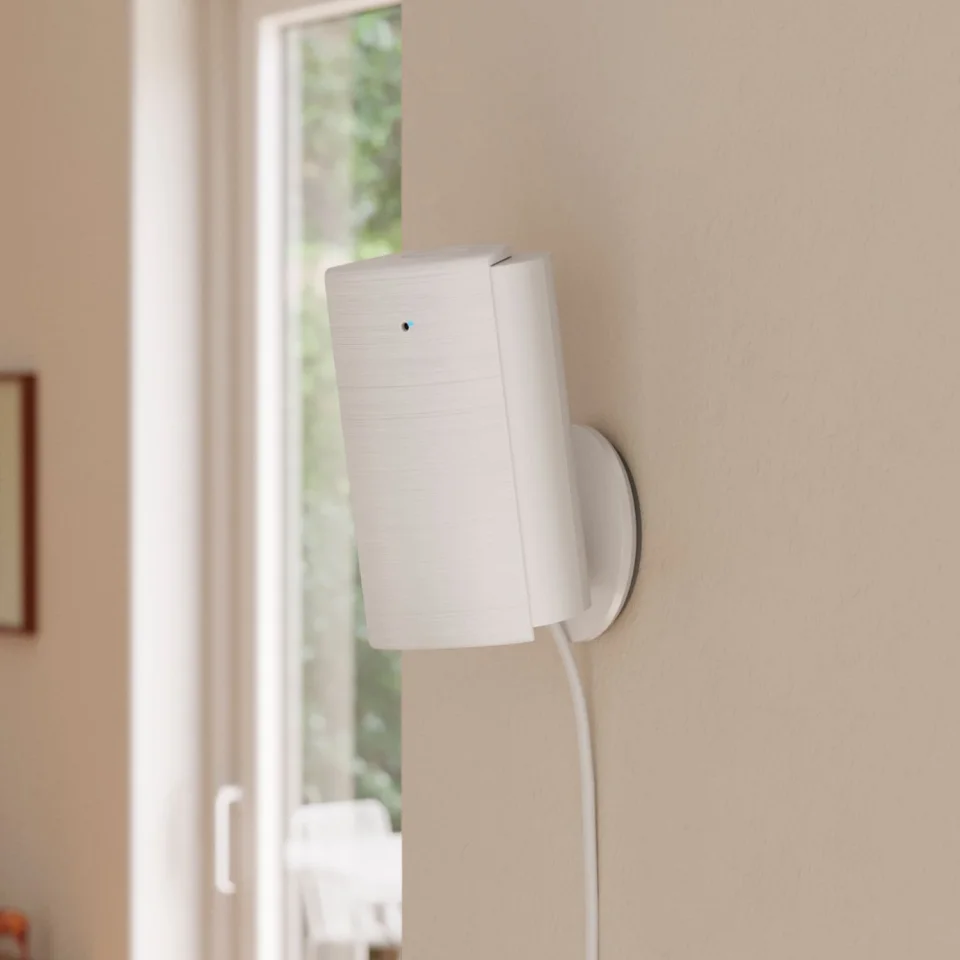 Ring Indoor Cam 4K wall-mounted with the detachable lens cover closed