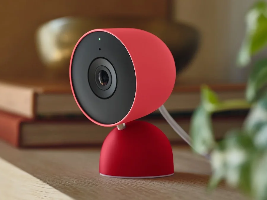 Google Nest Cam Indoor 3rd Gen in Berry on a wooden surface