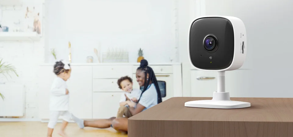 TP-Link Tapo C110 fixed indoor camera on a table watching a family kitchen