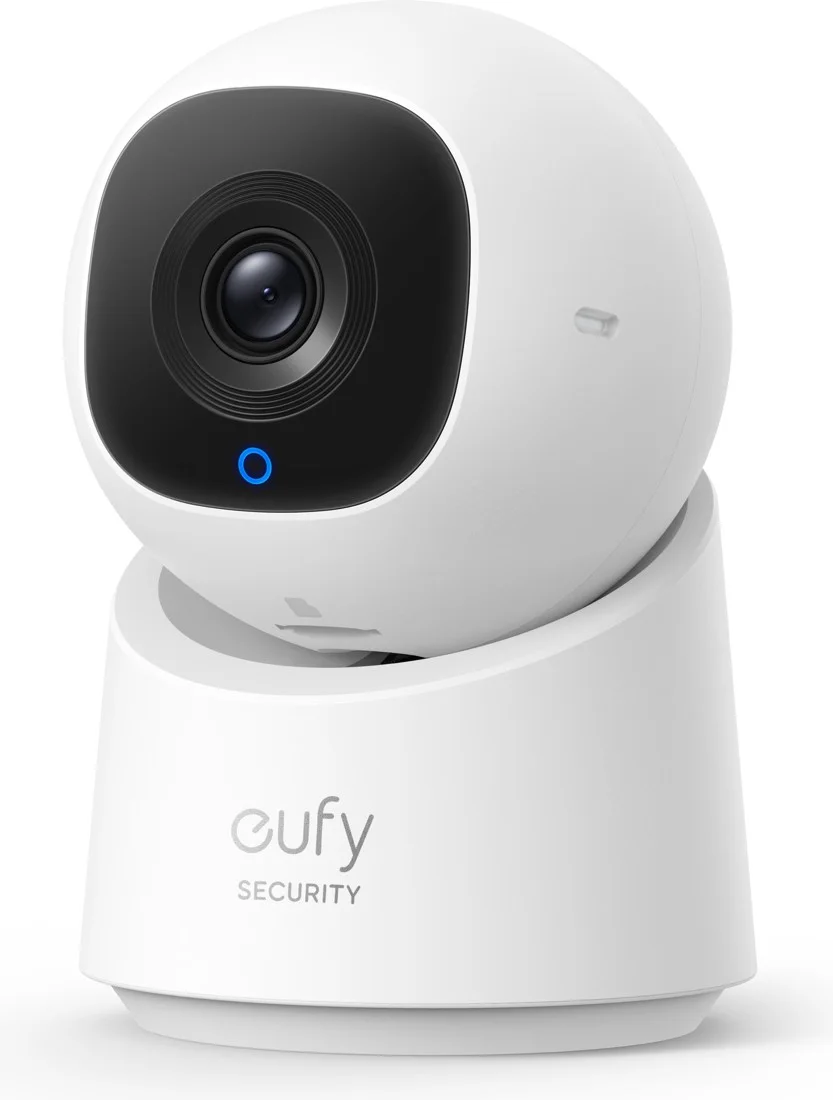 eufy IndoorCam C210 pan-and-tilt camera at an angle showing the lens, blue status ring, and eufy Security base