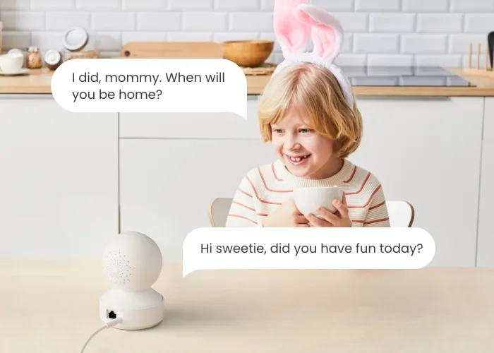 Official Reolink two-way audio scene showing a child at a kitchen table talking through a Reolink E1 camera