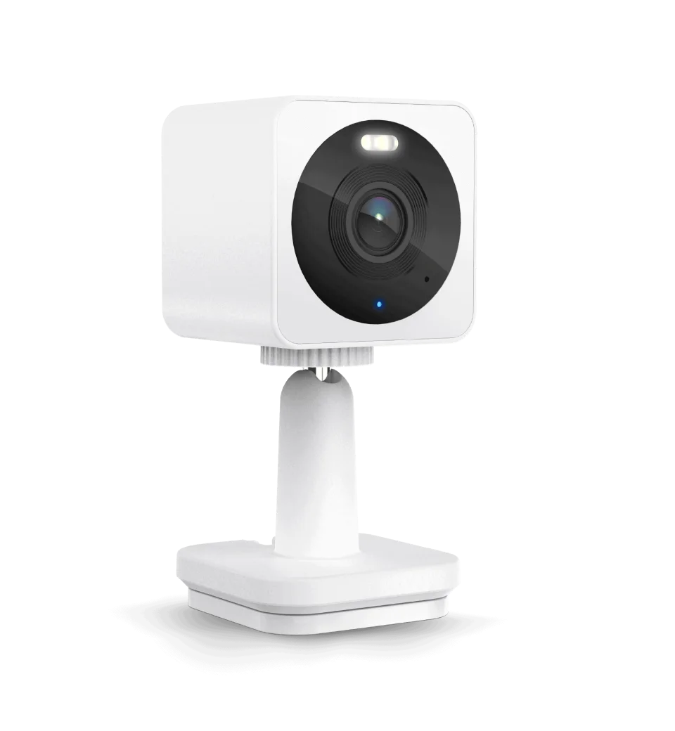 Wyze Cam OG in white on its stand, front view with the built-in spotlight lit